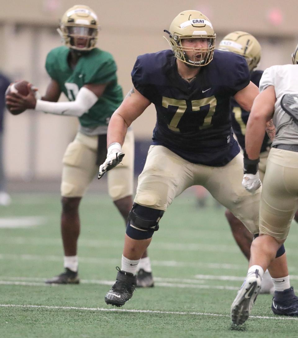 University of Akron offensive lineman Xavior Gray drops back into pass protection during the team's spring game on Saturday at Stile Field House. [Phil Masturzo/Beacon Journal]