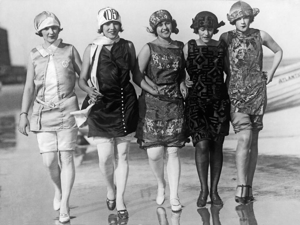 Five of the contestants in the Miss America contest walk along the beach in Atlantic City, New Jersey, in July 1924.
