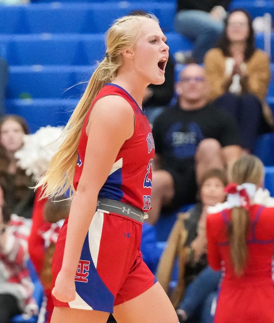 Indian Creek Faith Wiseman (21) yells in excitement Thursday, Nov. 16, 2023, during the semifinals of the Johnson County Tournament at Franklin Community High School in Franklin. The Center Grove Trojans defeated Indian Creek, 61-52.