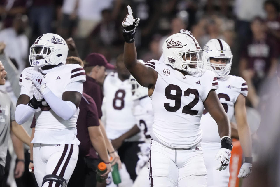 Mississippi State defensive lineman Eric Taylor (92) celebrates their 31-24 overtime win over Arizona during an NCAA college football game, Saturday, Sept. 9, 2023, in Starkville, Miss. (AP Photo/Rogelio V. Solis)