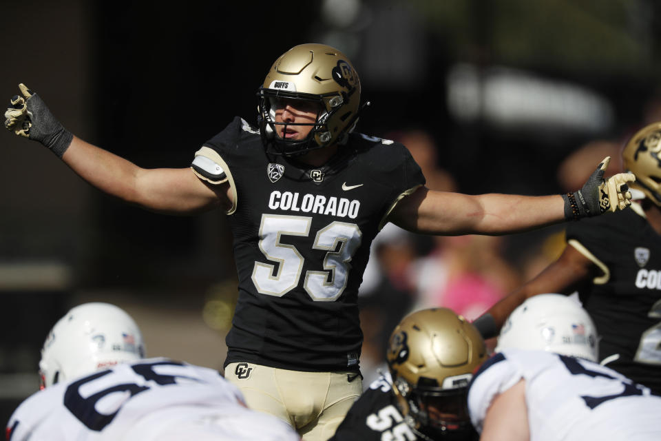 FILE - In this Oct. 5, 2019, file photo, Colorado's Nate Landman directs teammates in the first half of an NCAA college football game in Boulder, Colo. Senior inside linebacker Landman will again be one of the team’s leader. He has been voted Colorado’s defensive MVP for the past two seasons. (AP Photo/David Zalubowski, File)