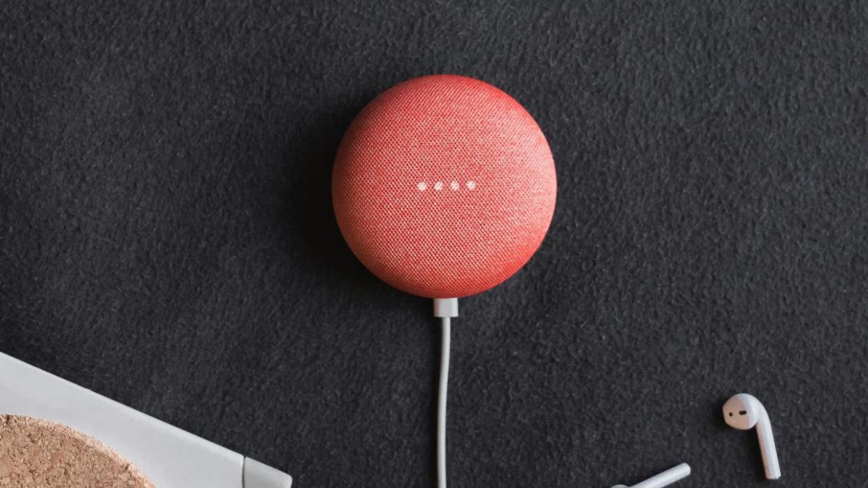  Lifestyle image of the pink Google Nest Mini. 