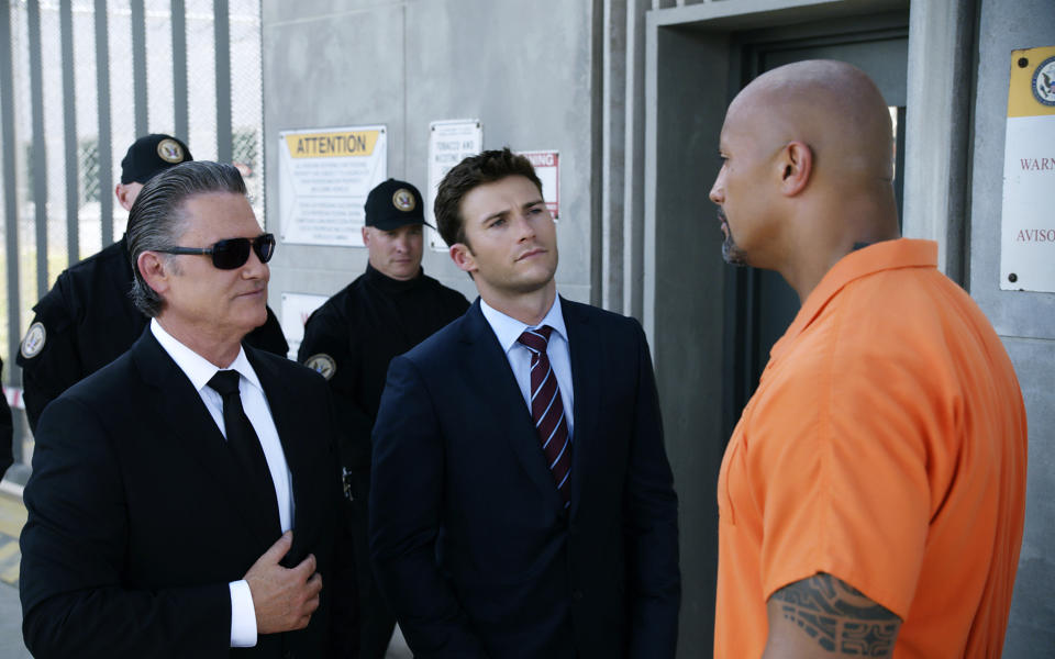 This image released by Universal Pictures shows Kurt Russell, from left, Scott Eastwood and Dwayne Johnson in "The Fate of the Furious." (Universal Pictures via AP)