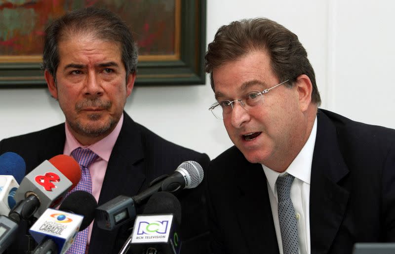 FILE PHOTO: Jaime Gilinski speaks next to Camilo Verastegui, president of Sudameris Colombia, during a news conference in Bogota