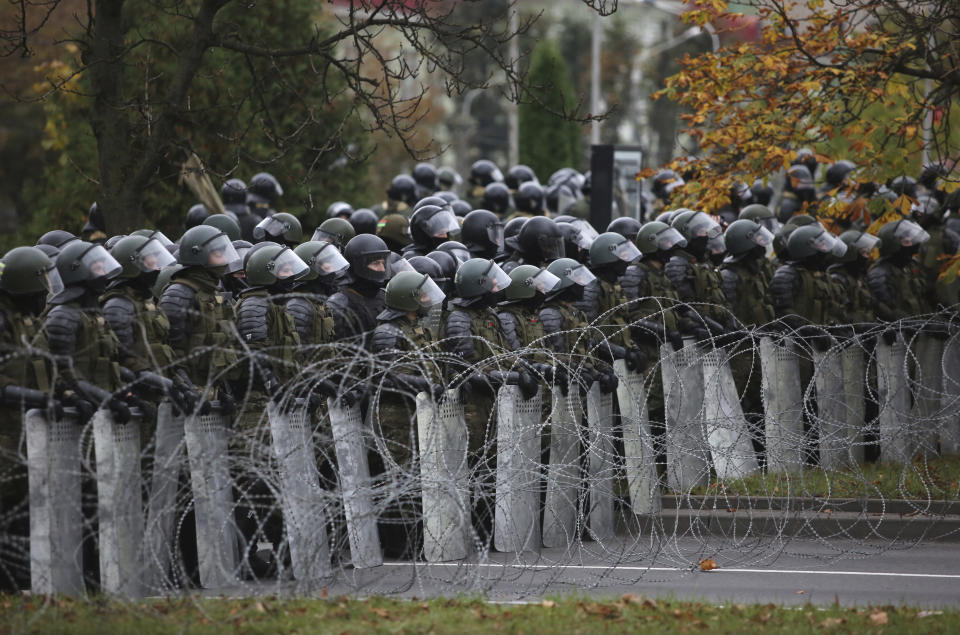 Belarusian police block a street during an opposition rally to protest the official presidential election results in Minsk, Belarus, Sunday, Oct. 25, 2020. The demonstrations were triggered by official results giving President Alexander Lukashenko 80% of the vote in the Aug. 9 election that the opposition insists was rigged. Lukashenko, who has ruled Belarus with an iron fist since 1994, has accused the United States and its allies of fomenting unrest in the ex-Soviet country. (AP Photo)