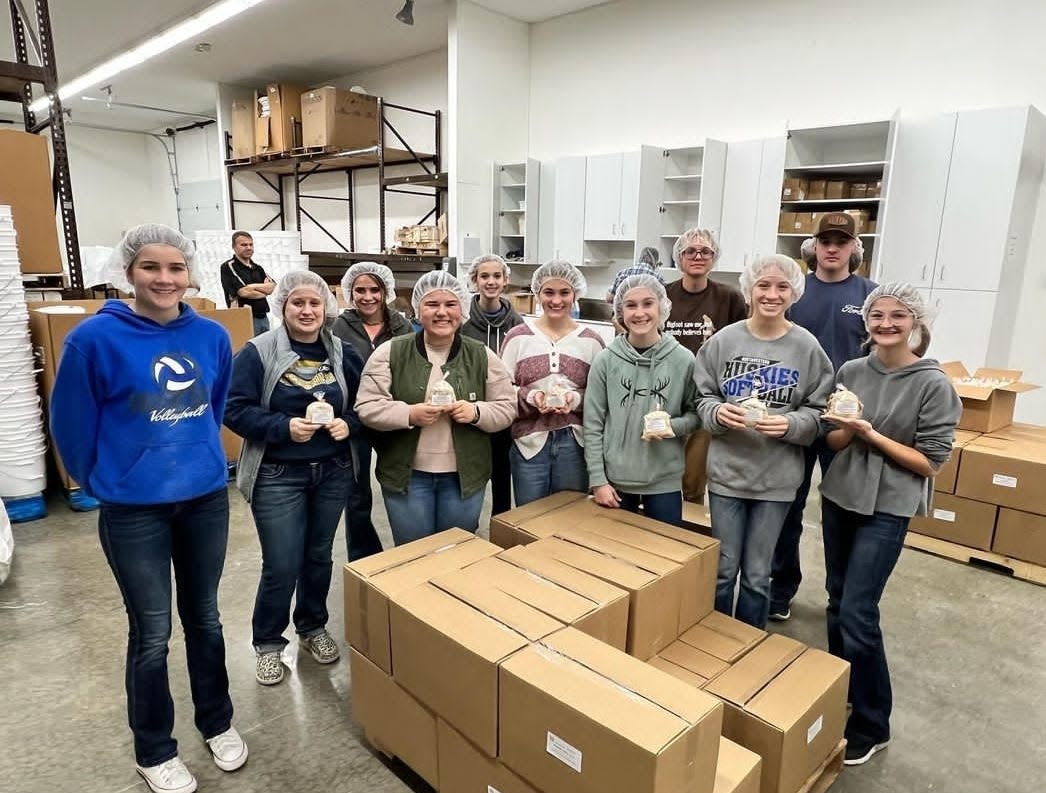 Northwestern FFA students help with soup packaging at Harvest Call Distribution Center in Sterling.