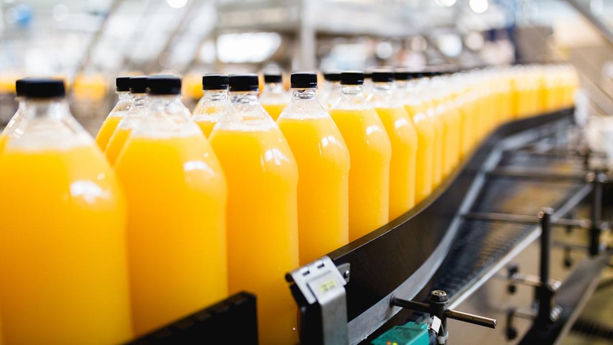 bottled orange juice in a factory