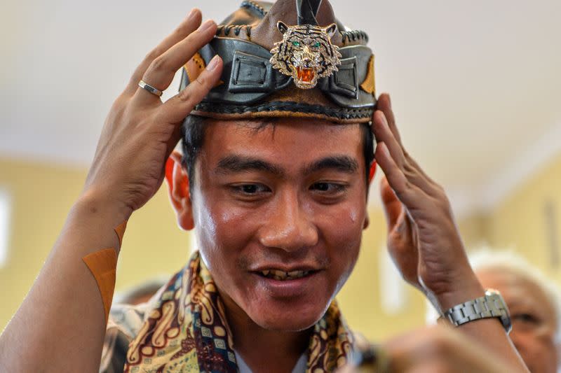 Indonesian vice-presidential candidate Gibran Rakabuming Raka, who is the eldest son of Indonesian President Joko Widodo, gestures during his campaign rally in Sumedang