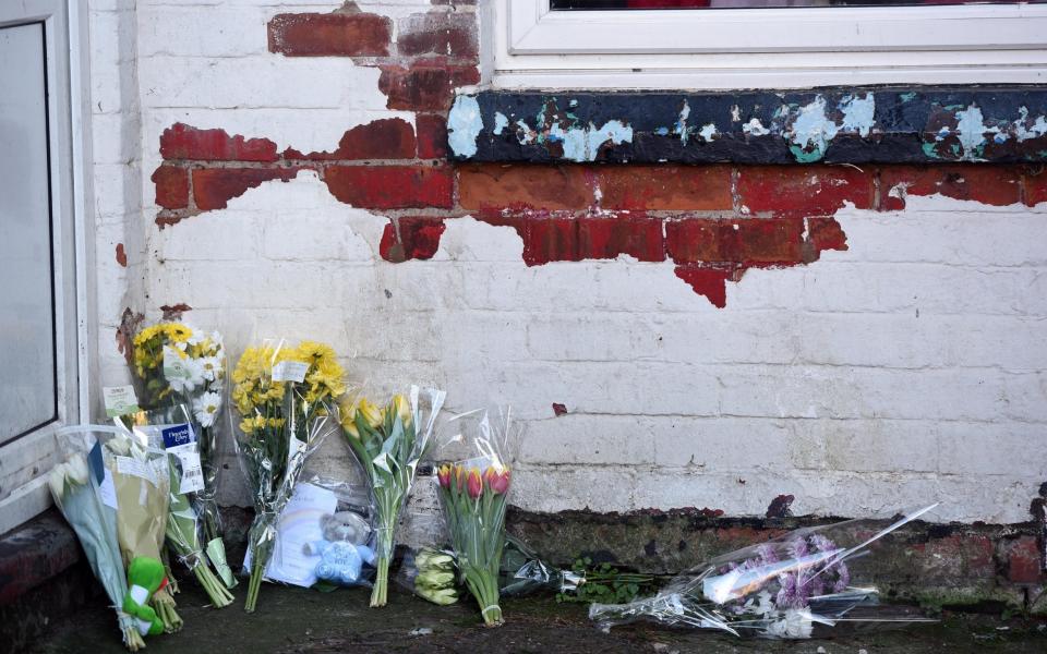 Floral tributes left by the door of the Skegness flat where Bronson Battersby lived