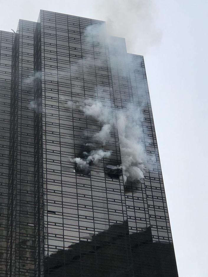 <p>Smoke rises from the 50th floor of Trump Tower in New York City on April 7, 2018. (Photo: Muhammed Said Tanl/Anadolu Agency/Getty Images) </p>