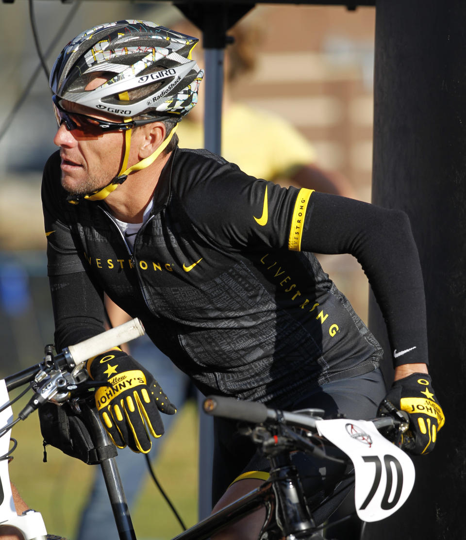 In this Aug. 25, 2012, file photo, cyclist Lance Armstrong prepares to take part in the Power of Four mountain bicycle race in Snowmass Village, Colo. With U.S. anti-doping officials set to issue their report on Armstrong's case, a lawyer for the cyclist on Tuesday again criticized the process which led to himn being banned from the sport for life. 