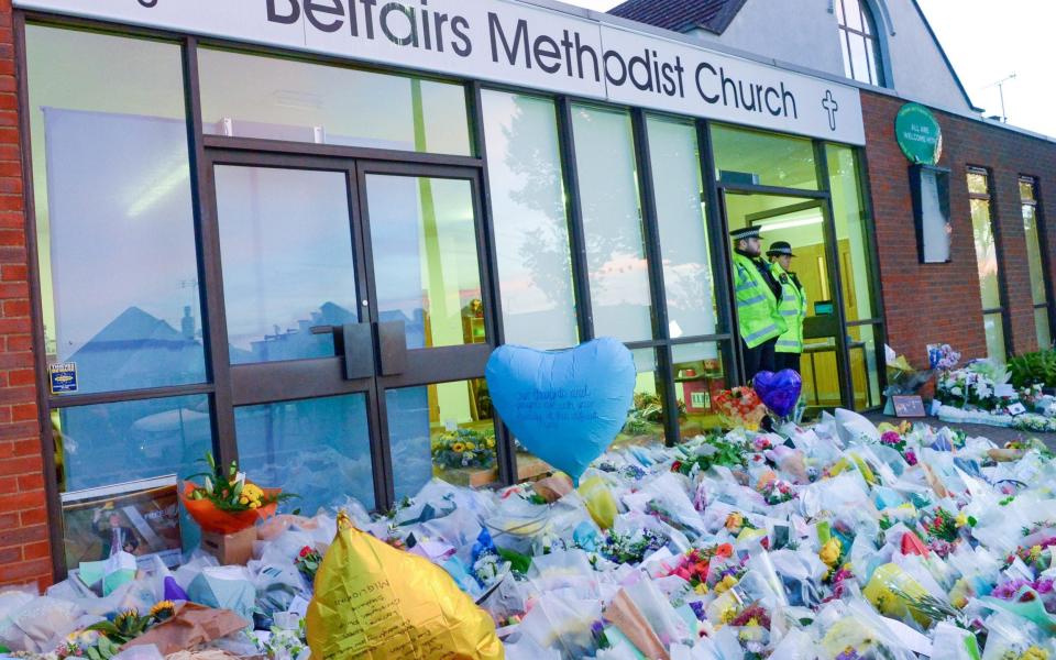 Police moved the floral tributes overnight and put them all together outside the Belfairs Methodist church where MP Sir David Amess was murdered - Rob Welham / John McLellan