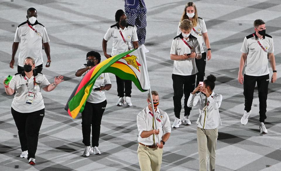 The athletes wore light-colored colored shirts with printed detailing and matching pants