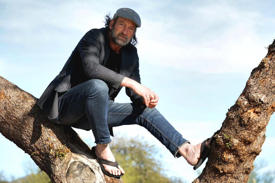 Troy Kotsur, nominated for an Oscar for best supporting actor for his role in the film "CODA," poses for a photo at Red Rock Park in Mesa, Ariz., on Jan. 28, 2022. (AP Photo/Matt York)