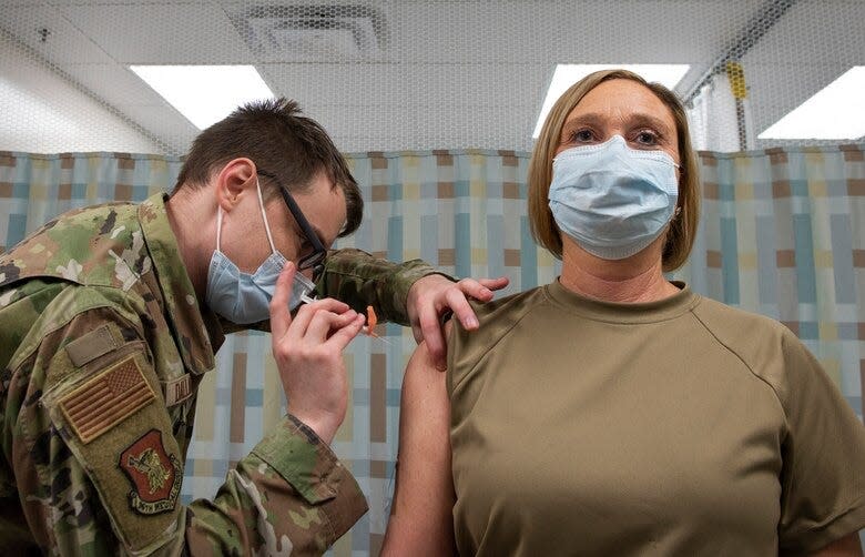 An Eglin Air Force Base airman receives a COVID-19 vaccination in 2021. A number of military personnel, including two Eglin officers, have filed a federal lawsuit challenging the military vaccine mandate.
