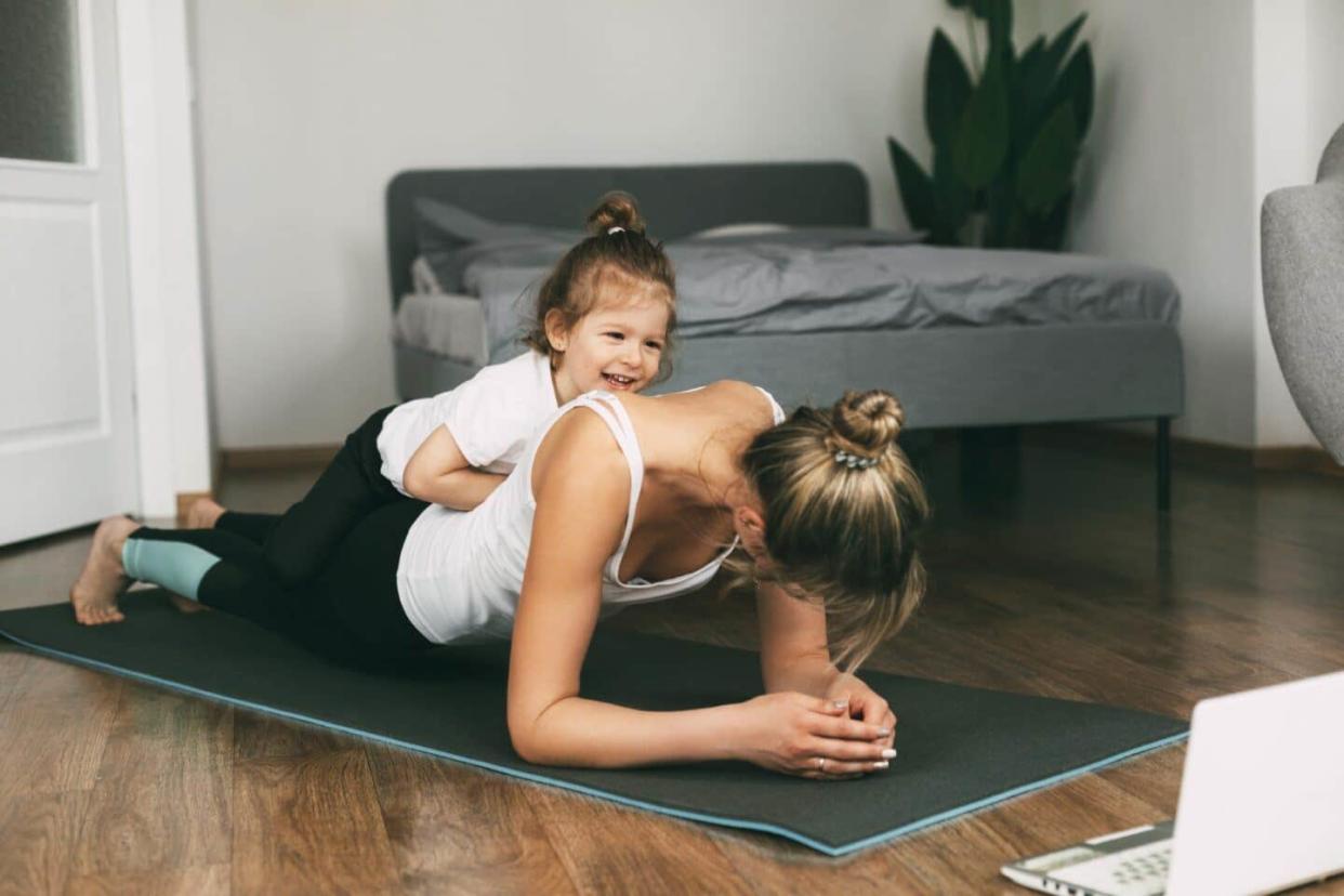 self care for moms: mother exercising at home with daughter - self-care for moms