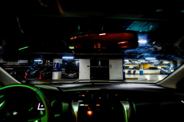 View through car safety glass at a garage of armoured cars in Caracas, Venezuela, where even low-end vehicles are getting safety reinforcements