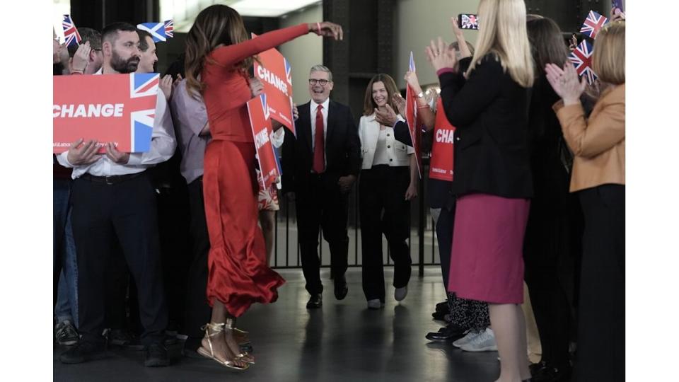 June Sarpong (in red) jumped for joy as Keir Starmer and his wife arrived at the Tate Modern for a watch party for the results of the 2024 General Election