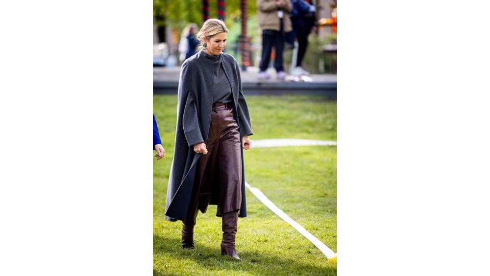 Queen Maxima walking in leather culottes