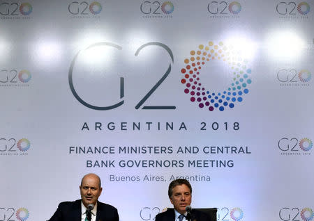 Argentina's Treasury Minister Nicolas Dujovne (R) and Argentina's Central Bank President Federico Sturzenegger attend a news conference at the G20 Meeting of Finance Ministers in Buenos Aires, Argentina, March 20, 2018. REUTERS/Marcos Brindicci