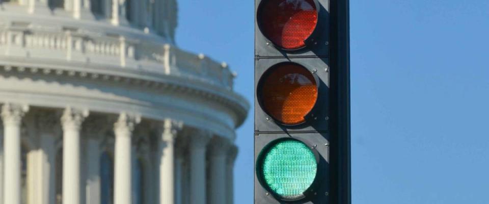 Green traffic light and U.S. Capitol Dome that symbolizes positive political decision -  Washington D.C. United States of America
