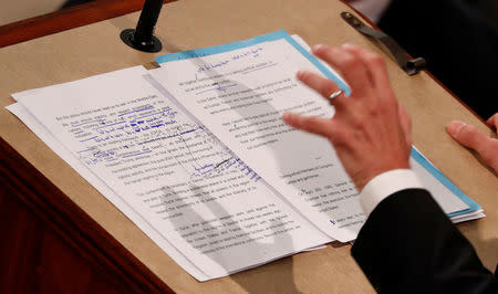 Hand written edits can he seen on French President Emmanuel Macron's speech in the section regarding the JCPOA Iran nuclear agreement as he addresses a joint meeting of the U.S. Congress in the House chamber of the U.S. Capitol in Washington, U.S., April 25, 2018. REUTERS/Jonathan Ernst