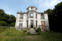 FILE PHOTO: Exterior view of an abandoned 19th century manor in Goussainville-Vieux Pays, 20 kms (12 miles) north of Paris, August 26, 2013. REUTERS/Charles Platiau/File Photo