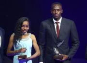 Usain Bolt of Jamaica (R) and Almaz Ayana of Ethiopia pose with their awards after being elected male and female World Athlete of the Year 2016 in Monaco, December 2, 2016. REUTERS/Eric Gaillard