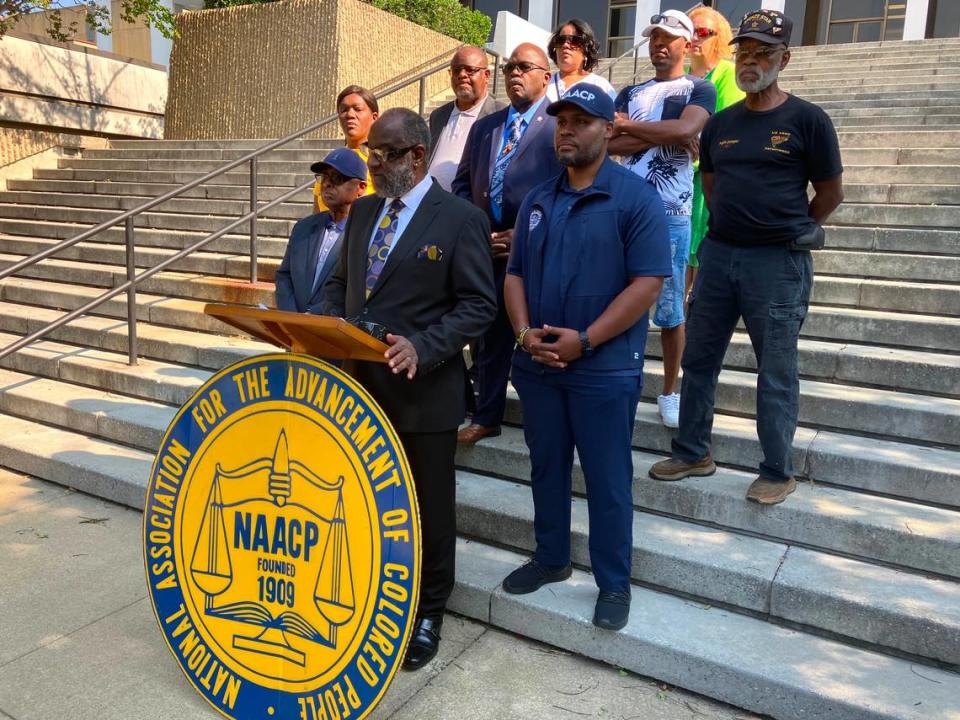 NAACP officials and supporters gather June 10, 2023, at the steps of the Columbus Government Center for a news conference announcing their condemnation of city and Georgia Republican Party officials for allowing former president Donald Trump to speak at the GOP state convention in the Columbus Convention & Trade Center despite being charged with federal crimes. Columbus NAACP branch president Wane Hailes is at the podium. Mark Rice/mrice@ledger-enqurer.com