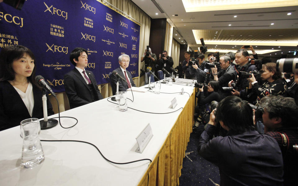 From left, Lawyer Eri Hironaka, Lawyer Sho Kosasa and Junichiro Hironaka, Chief defense lawyer of former Nissan chairman Carlos Ghosn's attend a press conference in Tokyo, Monday, March 4, 2019. Hironaka said Monday that Ghosn promised to accept camera surveillance as a way to monitor his activities if he is released from the detention center where he has been held since his Nov. 19 arrest. Ghosn has been charged with falsifying financial reports and breach of trust. (AP Photo/Koji Sasahara)