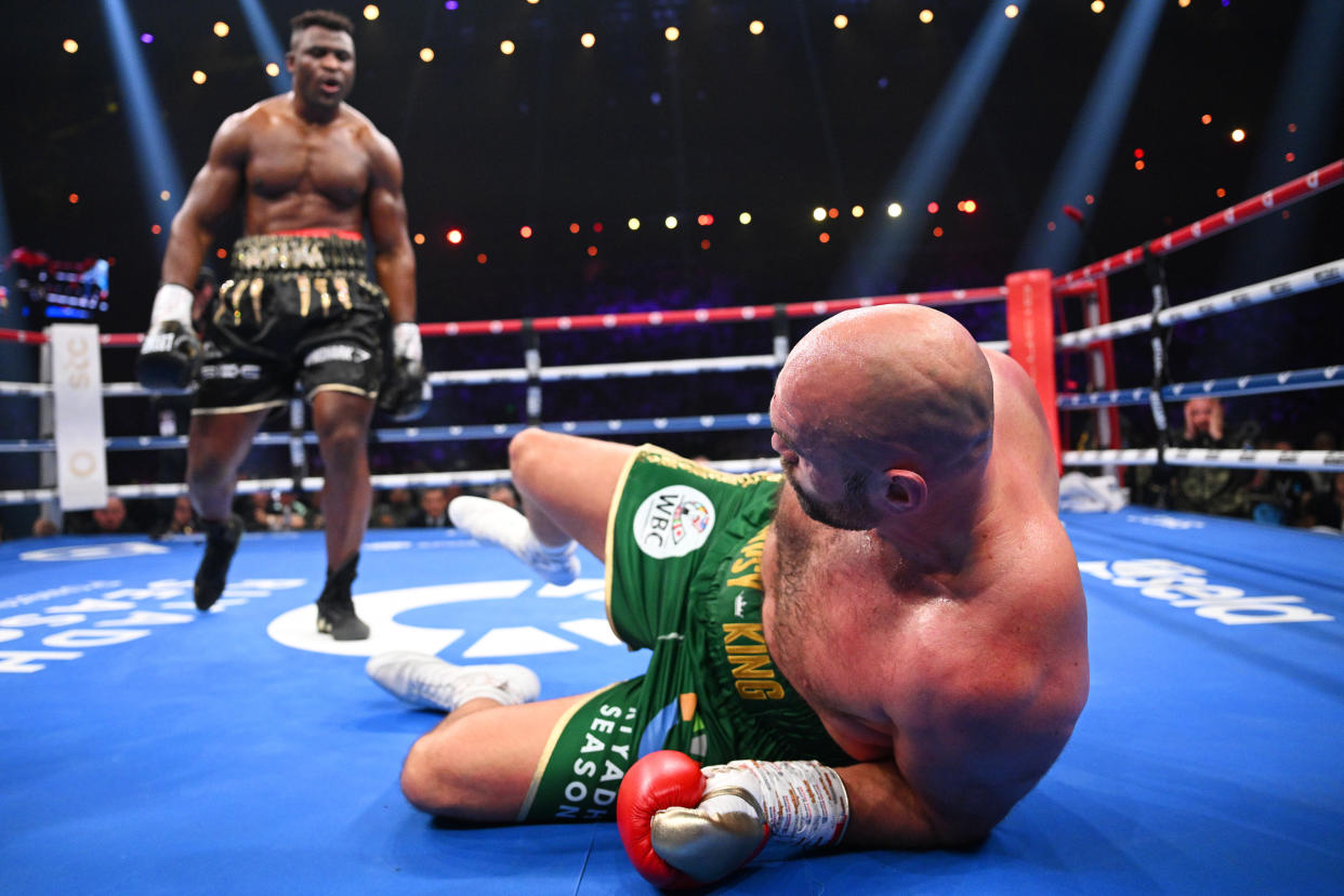 RIYADH, SAUDI ARABIA - OCTOBER 28: Francis Ngannou knocks down Tyson Fury during the Heavyweight fight between Tyson Fury and Francis Ngannou at Boulevard Hall on October 28, 2023 in Riyadh, Saudi Arabia. (Photo by Justin Setterfield/Getty Images)