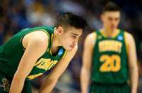 <p>Robin Duncan #4 of the Vermont Catamounts looks on from the court near his brother Ernie Duncan #20 while playing the Florida State Seminoles during their first round game of the 2019 NCAA Men’s Basketball Tournament at XL Center on March 21, 2019 in Hartford, Connecticut. (Maddie Meyer/Getty Images) </p>