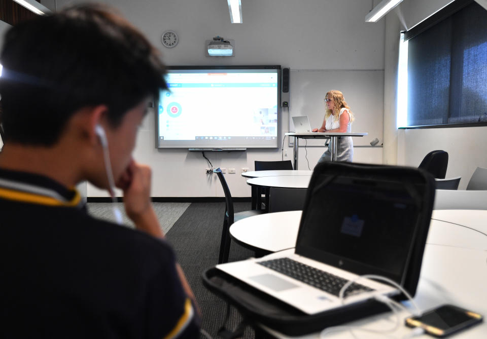 Teacher Cindy Bunder is seen demonstrating a virtual classroom at Glenunga High School in Adelaide, Friday, April 3, 2020. Source: AAP