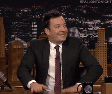 jimmy fallon doing a drumroll on his desk