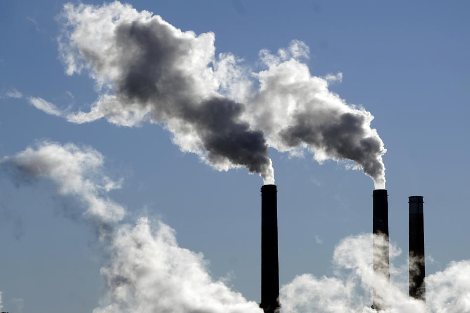 Steam is emitted from some of the Craig Station's smoke stacks Wednesday, Nov. 17, 2021, in Craig, Colo. The town in northwest Colorado is losing its coal plant, and residents fear it is the beginning of the end for their community. (AP Photo/Rick Bowmer)