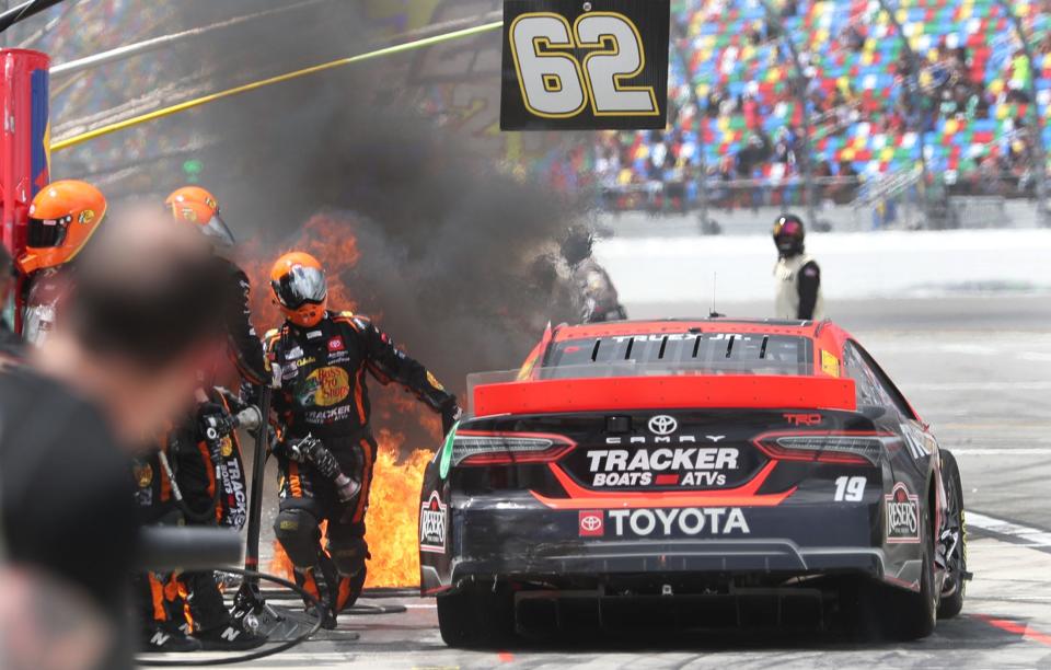 Martin Truex managed to dodge a small fire ball as he exited the pits during one Sunday stop. The flames weren't as close as they seem here, by the way, but in the pit stall just beyond Truex's car.