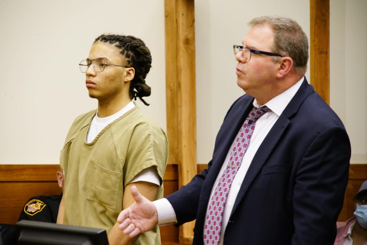 Keyontay Perry, 20, left, appeared Thursday with his lawyer, Thomas Gjostein, in Franklin County Common Pleas Court, where he was sentenced to at least 14 years in prison. Perry was convicted of fatally shooting 26-year-old Roger Kenneth Pindell in 2019 during a gun deal gone wrong.