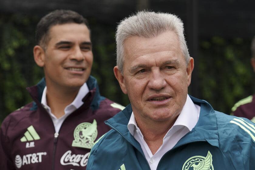 Mexico's new national football team coach Javier Aguirre, right, and his assistant.