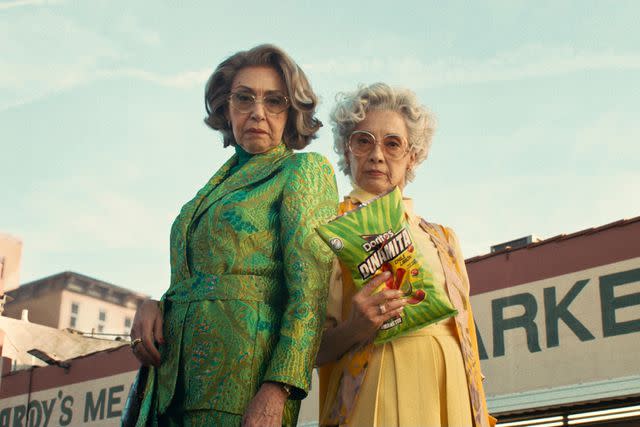 <p>FRITO-LAY</p> Dina and Mita are on the hunt for Doritos Dinamita chips in the Super Bowl ad