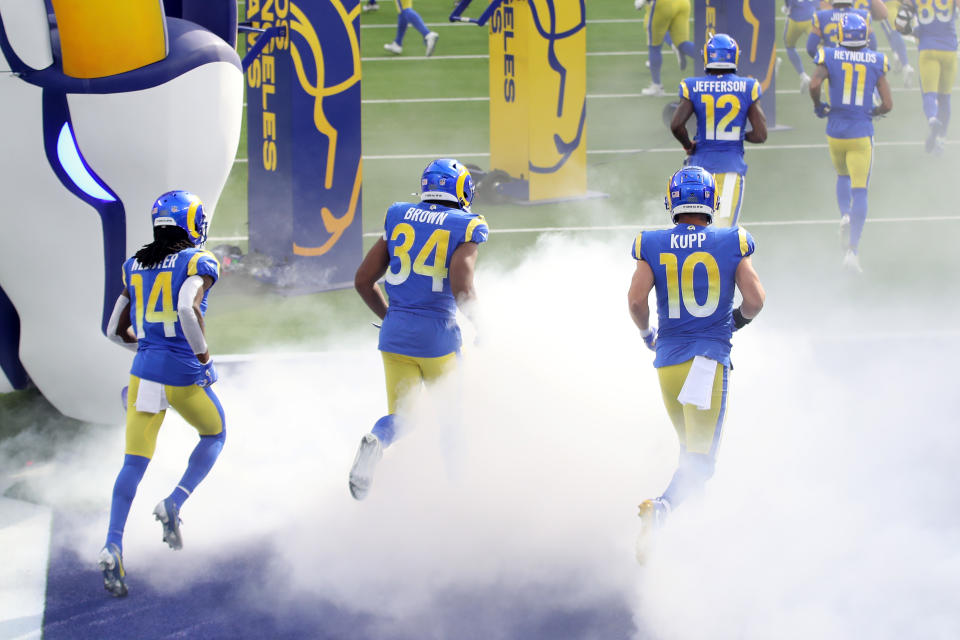 INGLEWOOD, CALIFORNIA - NOVEMBER 29: Nsimba Webster #14, Malcolm Brown #34 and Cooper Kupp #10 of the Los Angeles Rams run onto the field before the game against the San Francisco 49ers at SoFi Stadium on November 29, 2020 in Inglewood, California. (Photo by Katelyn Mulcahy/Getty Images)