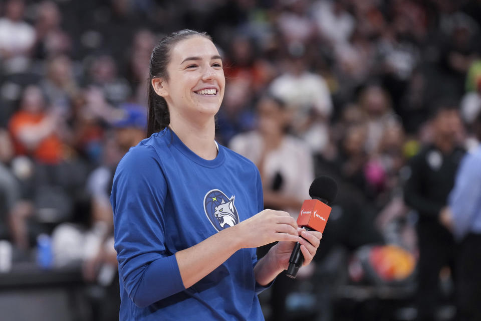 Minnesota Lynx's Bridget Carleton, of Canada, greets fans after a preseason WNBA basketball game against the Chicago Sky in Toronto, Saturday May 13, 2023. (Chris Young/The Canadian Press via AP)