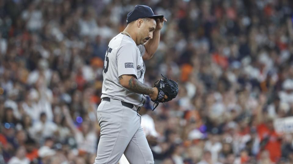 Mar 28, 2024; Houston, Texas, USA; New York Yankees starting pitcher Nestor Cortes (65) reacts after a pitch during the first inning against the Houston Astros at Minute Maid Park.