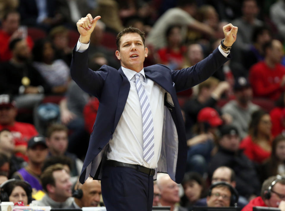 FILE - In this March 12, 2019, file photo, Los Angeles Lakers coach Luke Walton gestures to players during the second half against of the team's NBA basketball game against the Chicago Bulls, in Chicago. The Sacramento Kings have hired Luke Walton as their coach just days after he parted ways with the Los Angeles Lakers following three losing seasons. The Kings announced Monday, April 15, 2019, that Walton will replace Dave Joerger.(AP Photo/Nuccio DiNuzzo, File)