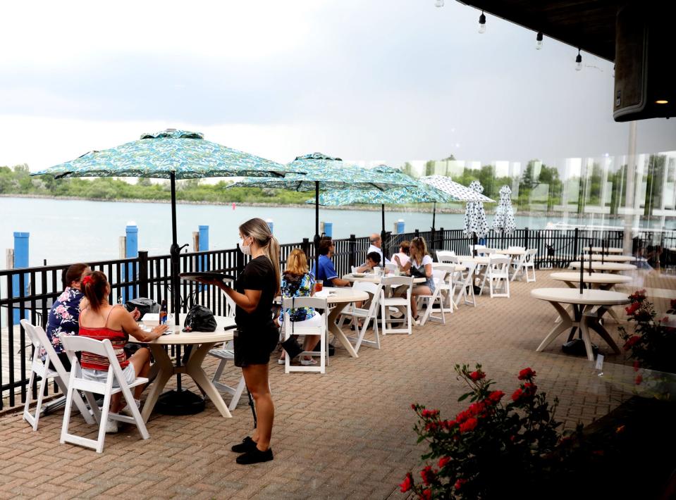Portofino in Wyandotte has a large deck area right off of the Detroit River as people enjoy the space eating on Wednesday afternoon, June 9, 2021.
