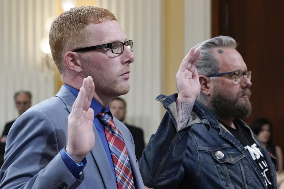 Stephen Ayres, who pleaded guilty in June 2022 to disorderly and disruptive conduct in a restricted building, left, and Jason Van Tatenhove, an ally of Oath Keepers leader Stewart Rhodes, right, are sworn in to testify as the House select committee investigating the Jan. 6 attack on the U.S. Capitol holds a hearing at the Capitol in Washington, Tuesday, July 12, 2022. (AP Photo/J. Scott Applewhite)