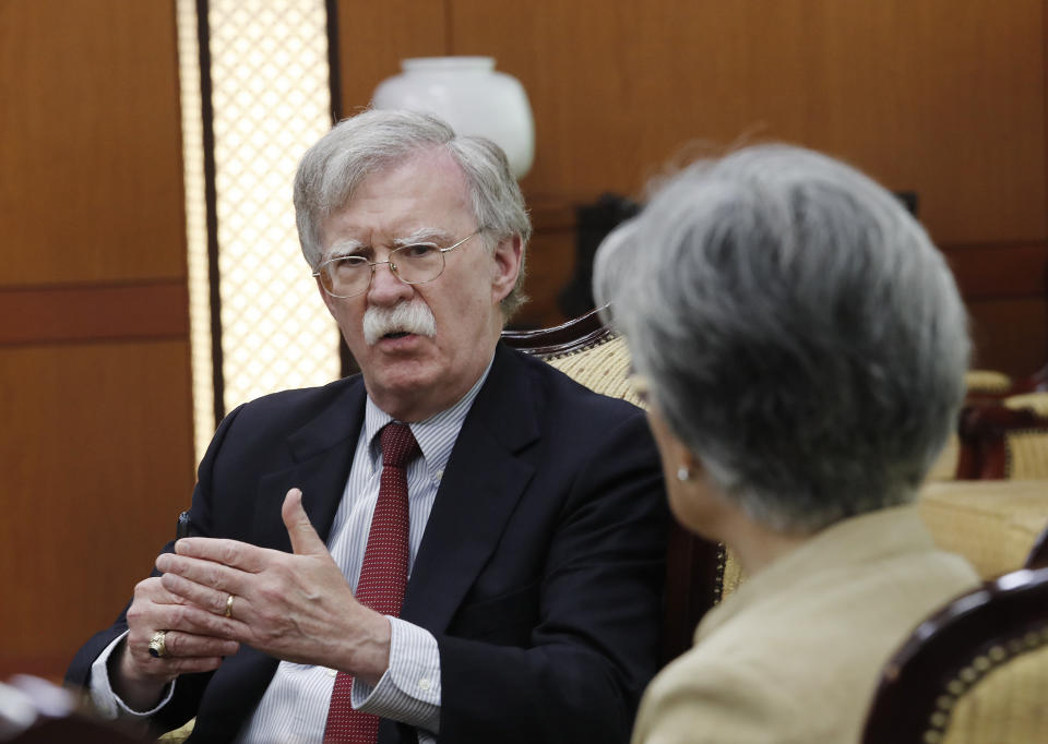 U.S. National Security Advisor John Bolton, left, talks with South Korean Foreign Minister Kang Kyung-wha during a meeting at the foreign ministry in Seoul, South Korea, Wednesday, July 24, 2019. (AP Photo/Ahn Young-joon, Pool)