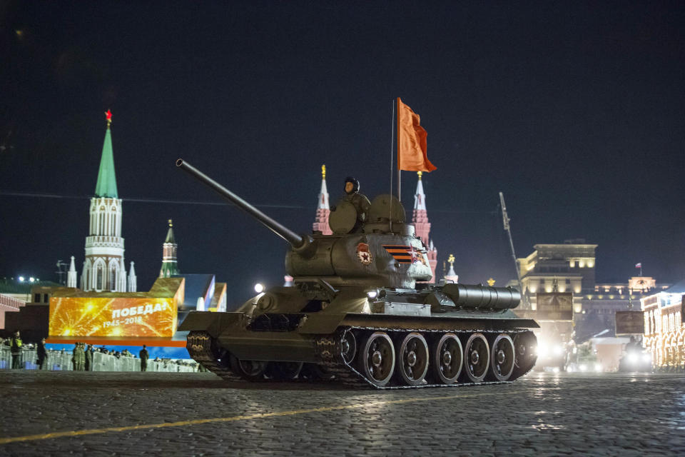 FILE - In this Thursday, May 3, 2018 filer, a World War II era Soviet tanks T-34 makes its way through the Red Square during a rehearsal for the Victory Day military parade in Moscow, Russia. The Russian Defense Ministry said Wednesday that it has received 30 T-34 tanks from Laos _ a move reflecting the national cult of the famed weapon. (AP Photo/Alexander Zemlianichenko, File)