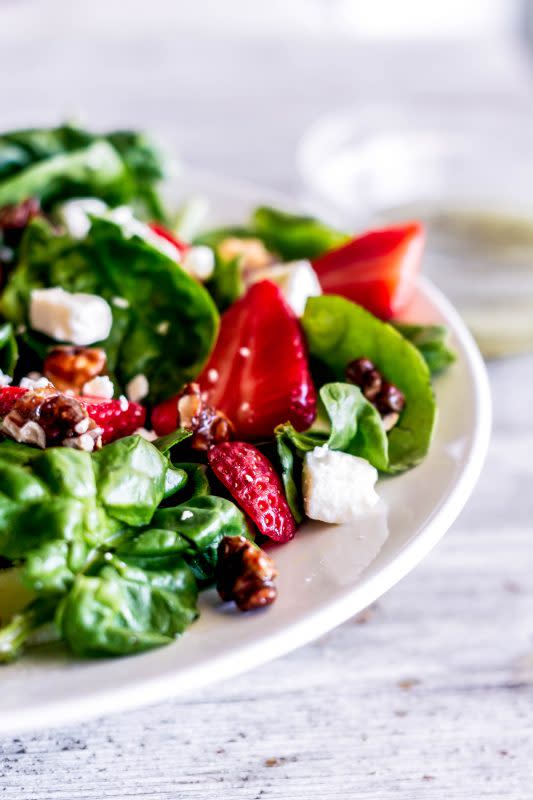 <p>Sweet Tea & Thyme</p><p>The salad that changed a salad hater's mind! Delicious and classic with juicy strawberries, creamy feta cheese and crunchy candied nuts with a bright lemon poppyseed dressing!</p><p><strong>Get the Recipe: </strong><a href="https://www.sweetteaandthyme.com/strawberry-spinach-salad-melting-pot/" rel="nofollow noopener" target="_blank" data-ylk="slk:Strawberry Spinach Salad;elm:context_link;itc:0;sec:content-canvas" class="link "><strong>Strawberry Spinach Salad</strong></a></p>