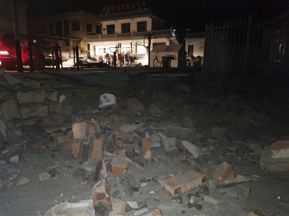 Debris from a wall brought down after an earthquake is seen in Jishishan county in northwest China's Gansu province Tuesday, Dec. 19, 2023. At least 100 people were killed in a magnitude 6.2 earthquake in a cold and mountainous region in northwestern China, the country's state media reported on Tuesday. (Chinatopix Via AP)