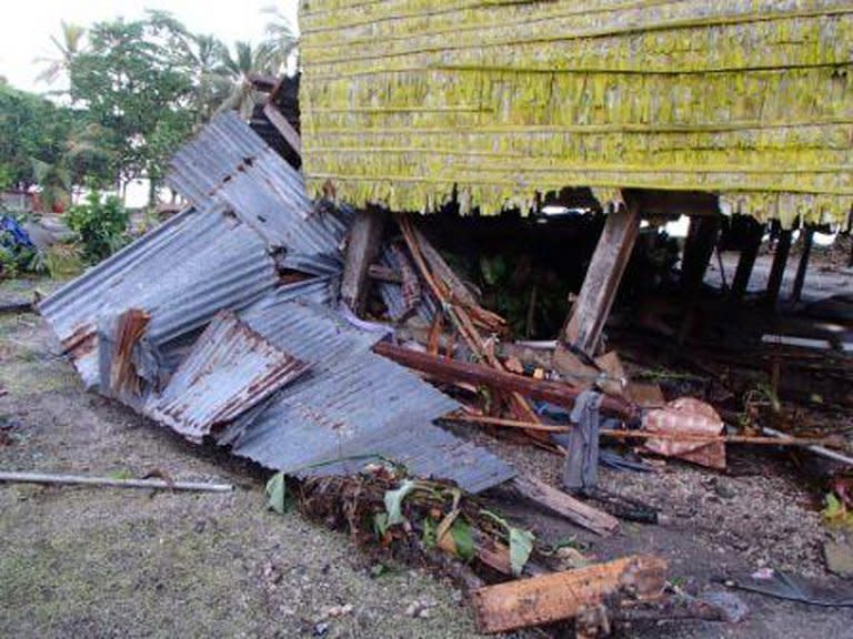 This photo, taken on February 7, 2013, by World Vision, shows damage to a house in the village of Louva, caused by a tsunami in the Santa Cruz Islands region of the Solomons Islands. Relief workers scrambled to reach quake-ravaged villages in the Solomons on Saturday, with "unusual seismic activity" sighted as strong aftershocks continued to jolt the remote Pacific region